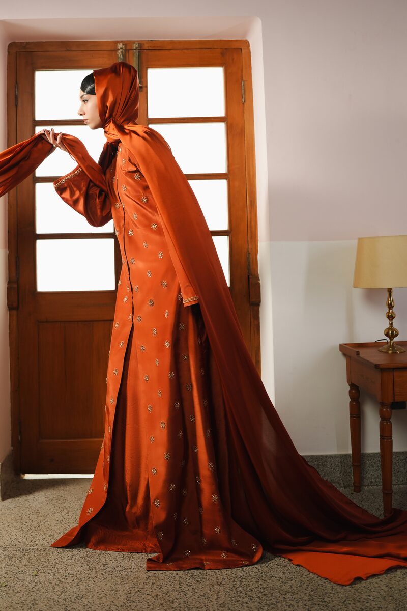 Amber, burnt orange gown