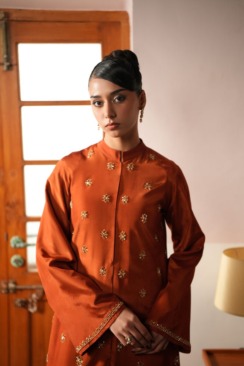 Amber, burnt orange gown