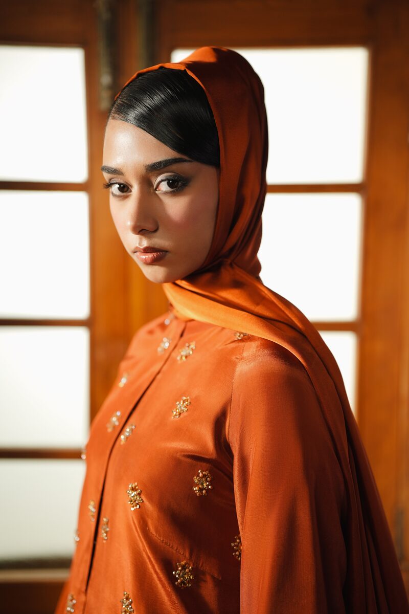 Amber, burnt orange gown