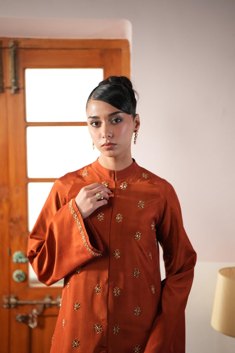 Amber, burnt orange gown