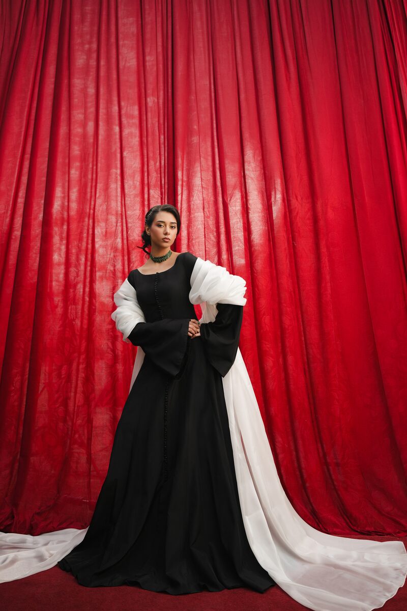Misk, black gown