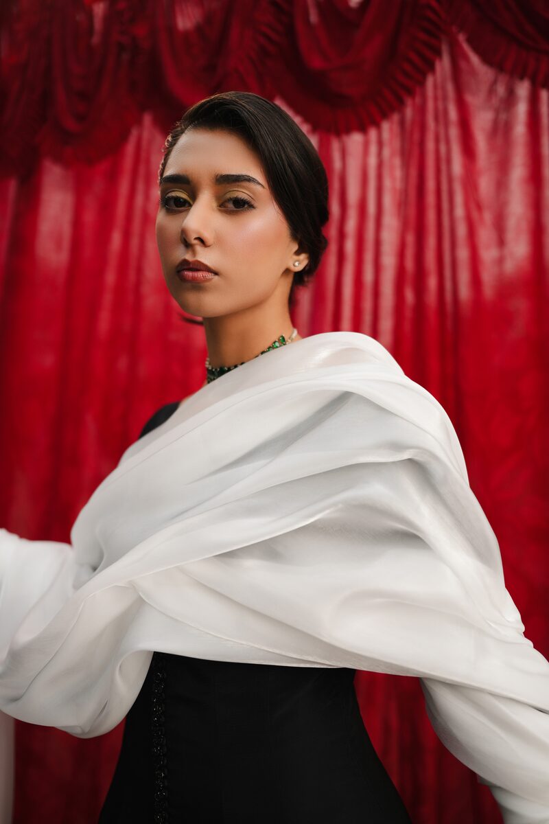 Misk, black gown