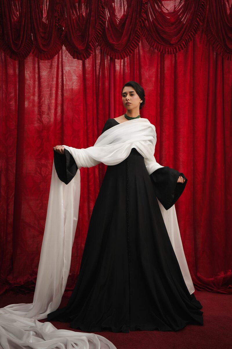 Misk, black gown
