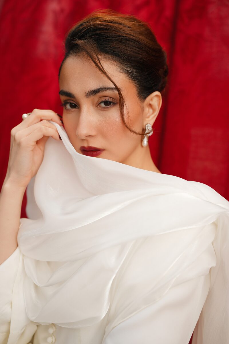 Noura, white gown